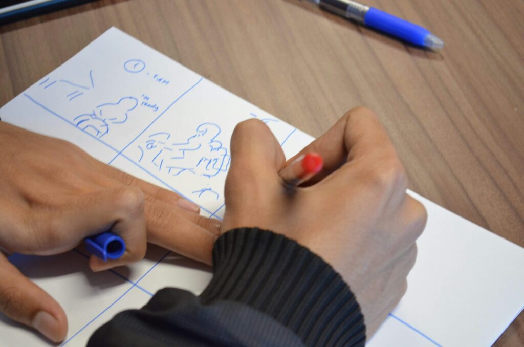 writing a storyboard on a paper 
